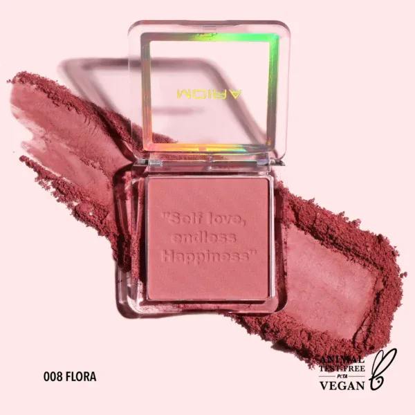 Polvo de rubor en tono rosa en envase transparente con espejo.